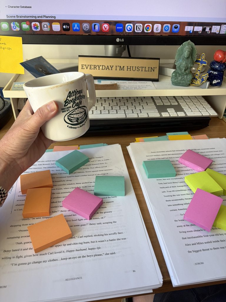 A mug of coffee hovering over a manuscript littered with post its